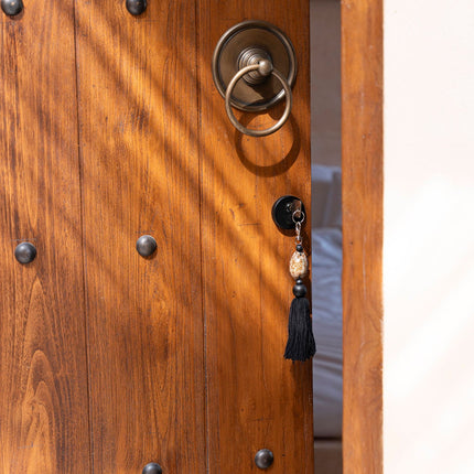 De Sumbawa-sleutelhanger - zwart-bruin