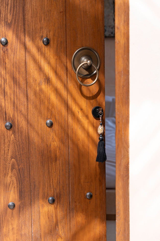 De Sumbawa-sleutelhanger - zwart-bruin