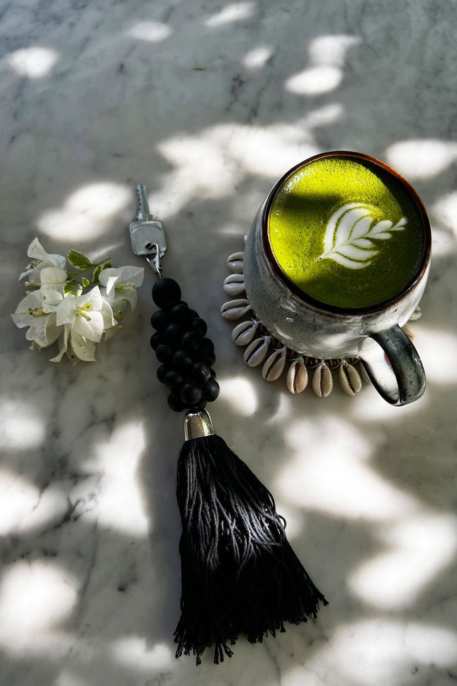 De houten kralensleutelhanger - zwart