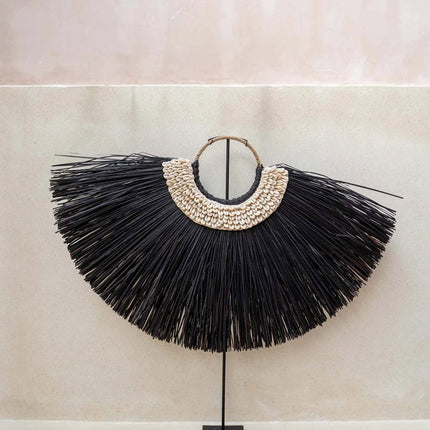 De Alang-cowrie op een standaard